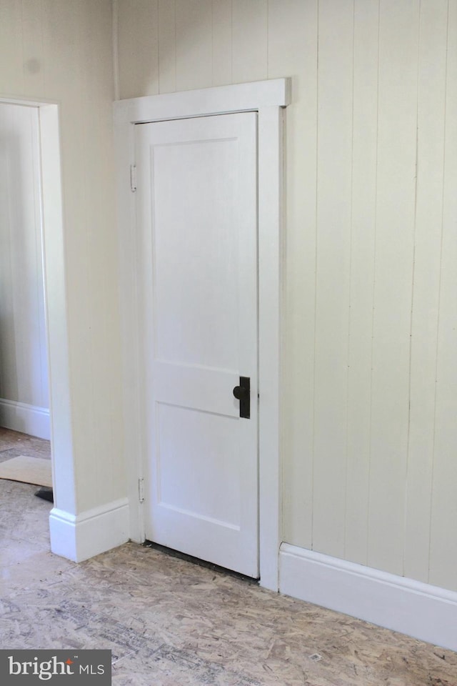 interior space featuring wooden walls