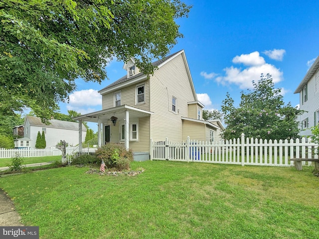 exterior space featuring a porch and a lawn