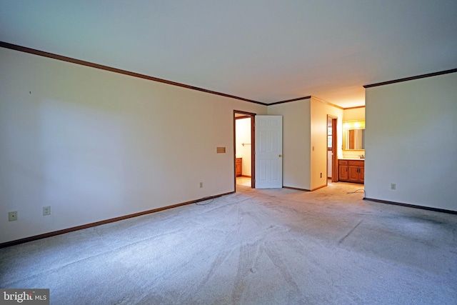 carpeted spare room with ornamental molding