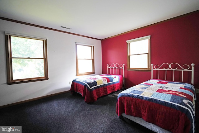 carpeted bedroom featuring multiple windows and ornamental molding