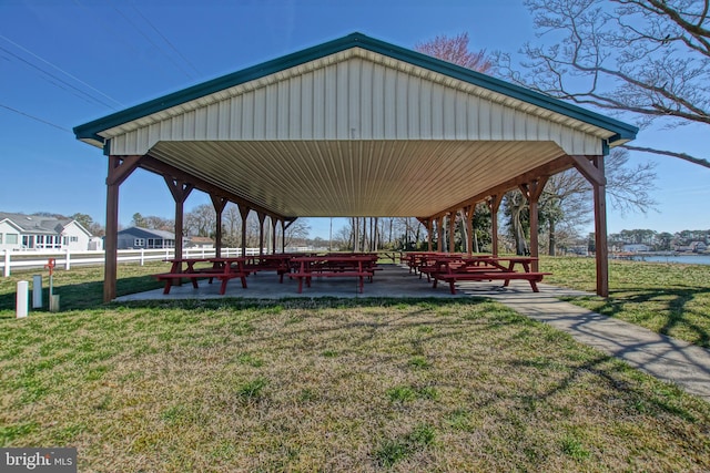 view of home's community with a yard