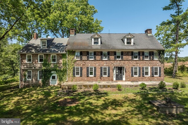 colonial house with a front lawn