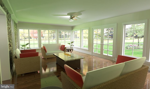 sunroom / solarium featuring ceiling fan