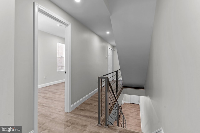 stairway featuring wood-type flooring