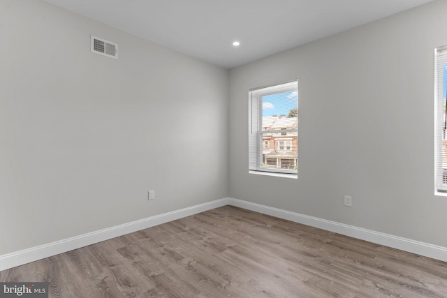 unfurnished room featuring light hardwood / wood-style floors