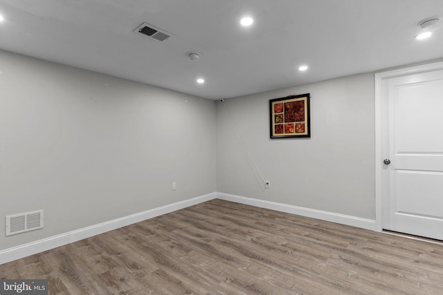 unfurnished room featuring light hardwood / wood-style floors