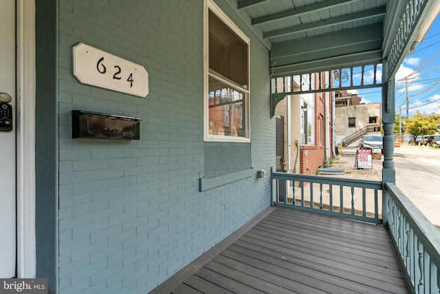 wooden deck featuring covered porch