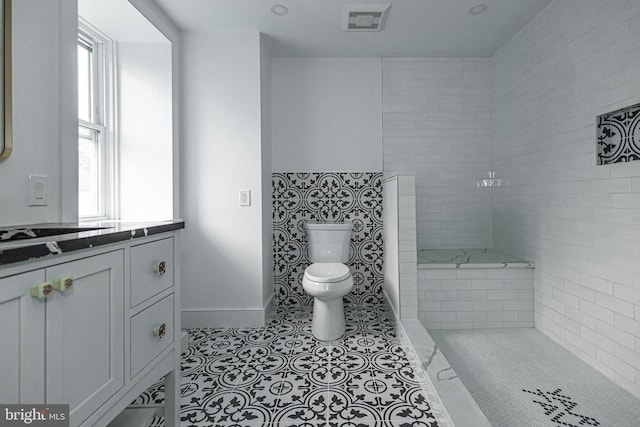 bathroom with vanity, tile patterned floors, and toilet