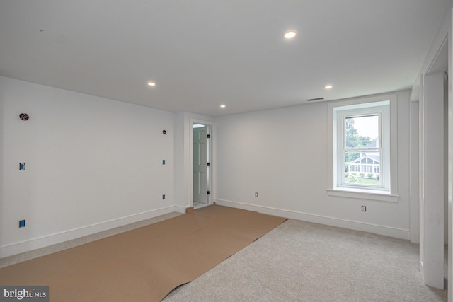 empty room with light colored carpet