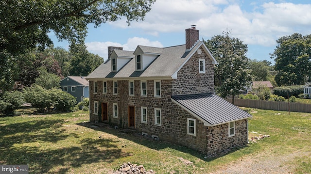 view of property exterior featuring a yard