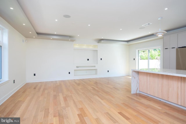 unfurnished living room with light hardwood / wood-style flooring