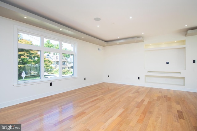 spare room with light wood-type flooring