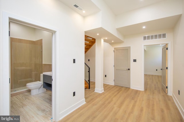 hallway featuring light hardwood / wood-style flooring