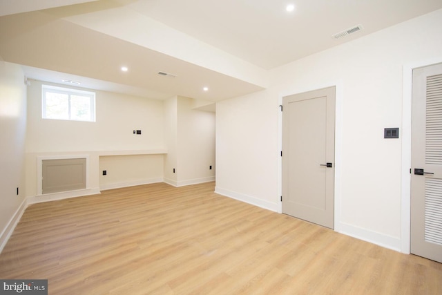 basement featuring light wood-type flooring