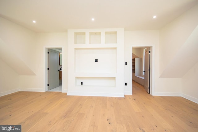 interior space featuring built in features and light hardwood / wood-style flooring