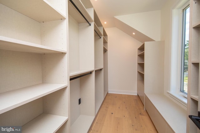 spacious closet featuring light hardwood / wood-style floors