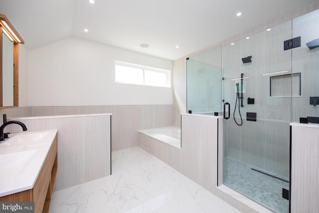 bathroom featuring tile patterned flooring, vaulted ceiling, plus walk in shower, and vanity