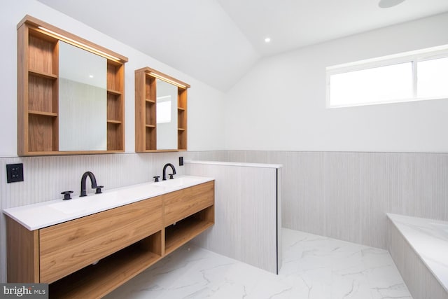 bathroom featuring vaulted ceiling, vanity, and tile patterned floors