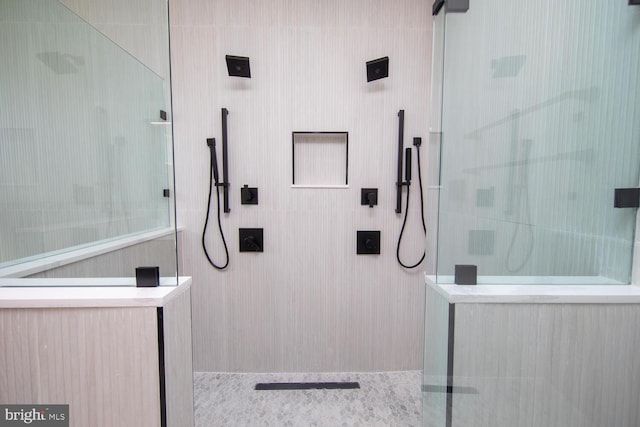 bathroom with tiled shower