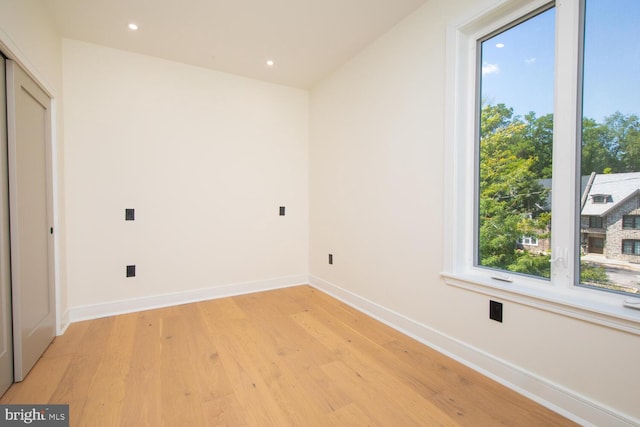 unfurnished bedroom featuring light wood-type flooring