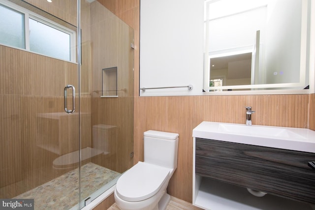 bathroom with an enclosed shower, toilet, and vanity