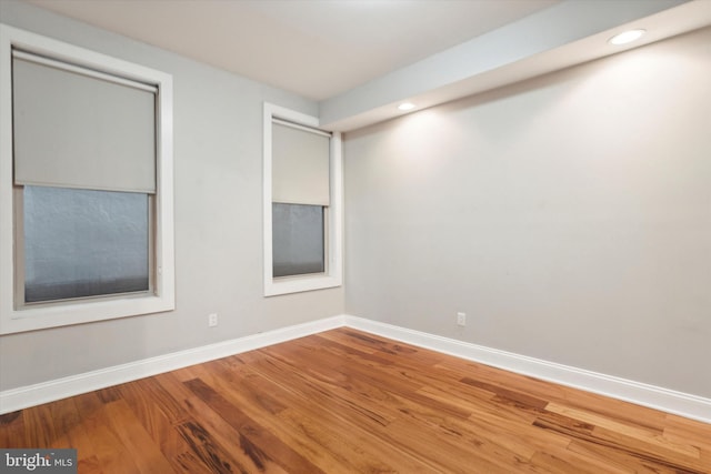 empty room with wood-type flooring