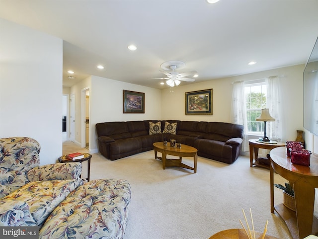 living room with light colored carpet and ceiling fan