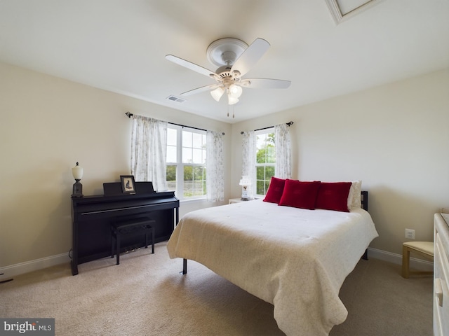 carpeted bedroom with ceiling fan