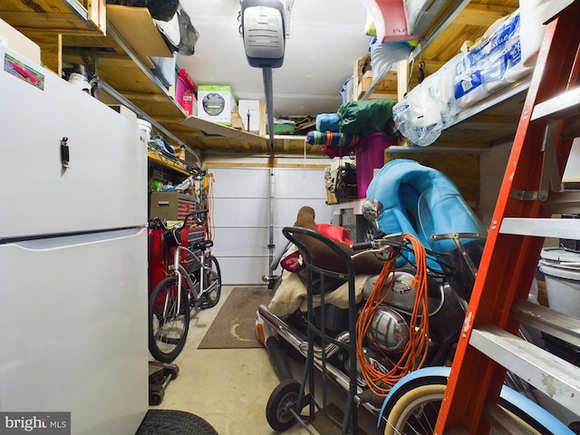 garage featuring white fridge