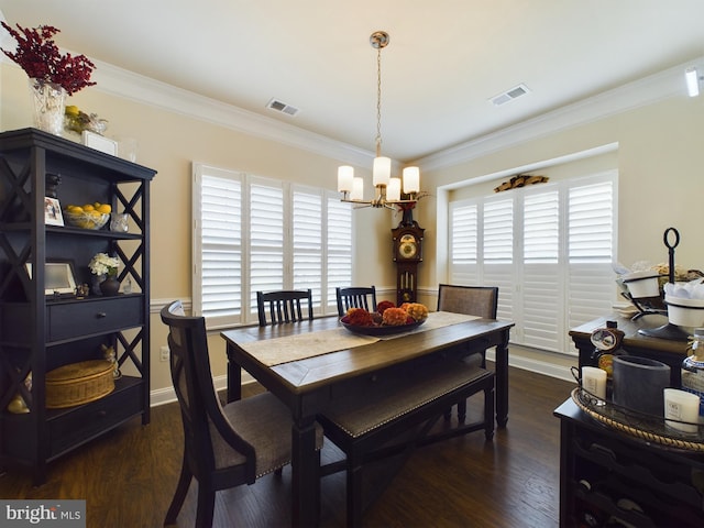 dining room featuring crown molding, a notable chandelier, and dark hardwood / wood-style flooring