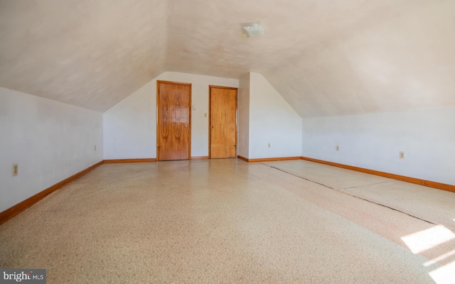 bonus room featuring lofted ceiling