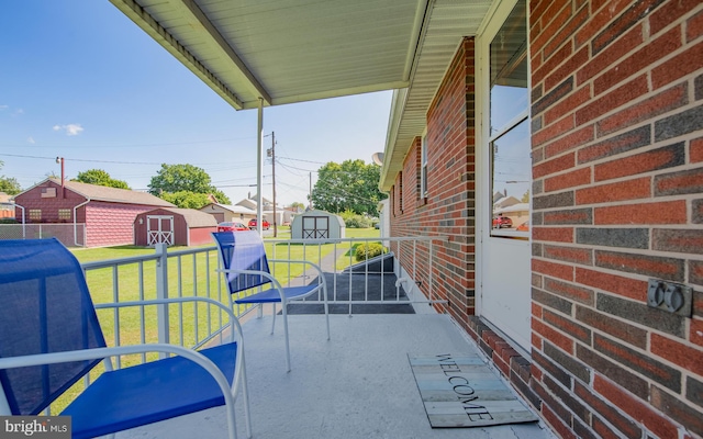 view of patio / terrace featuring a storage shed