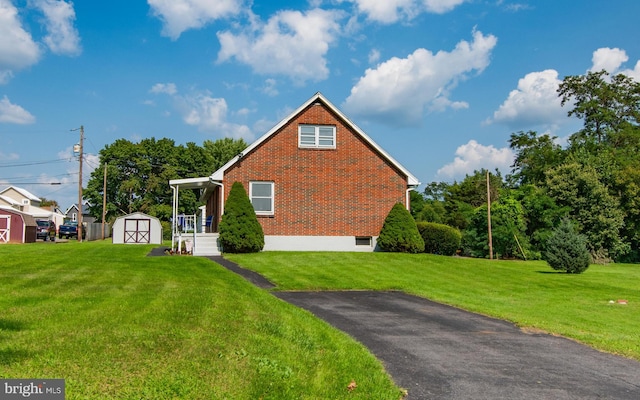 view of property exterior featuring a yard and a storage shed