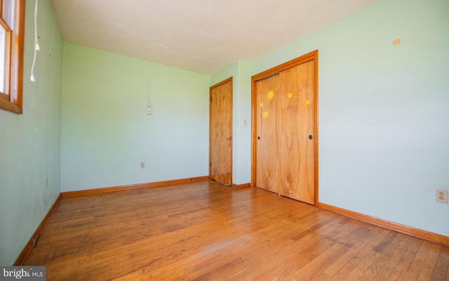 unfurnished bedroom with light hardwood / wood-style flooring