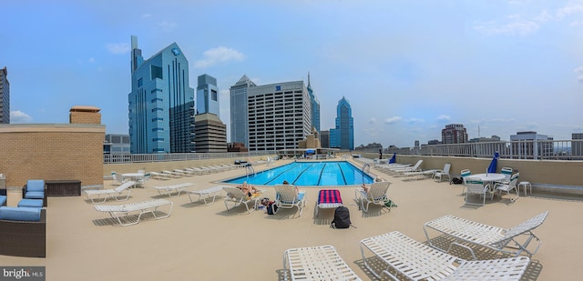 view of swimming pool with a patio area