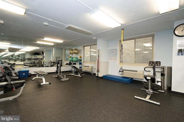 exercise room with a wall mounted AC