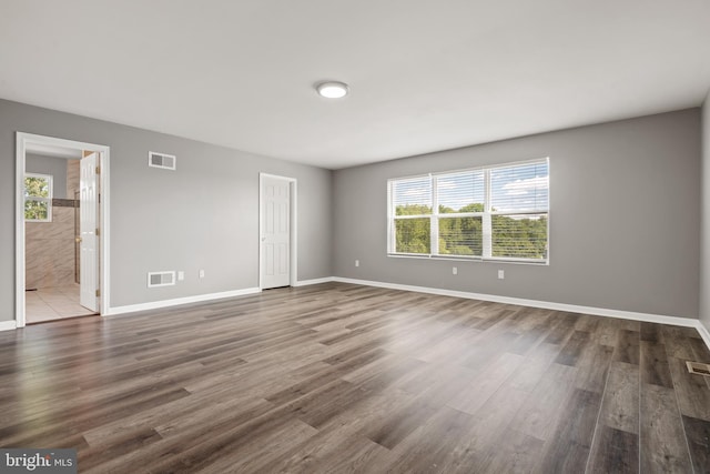 unfurnished room featuring hardwood / wood-style flooring