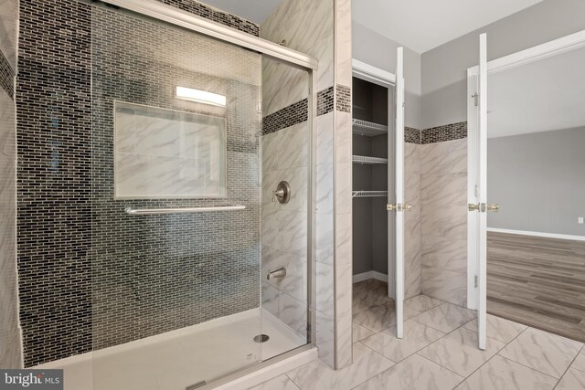 bathroom featuring an enclosed shower