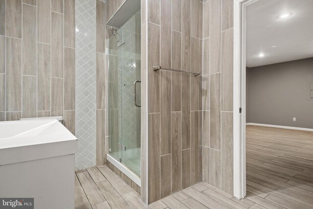 bathroom with vanity and an enclosed shower