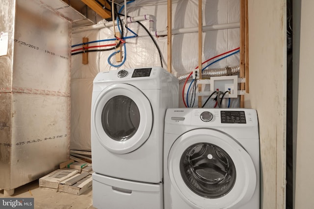 washroom featuring washing machine and dryer