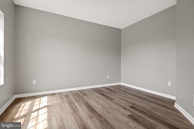 spare room featuring hardwood / wood-style floors