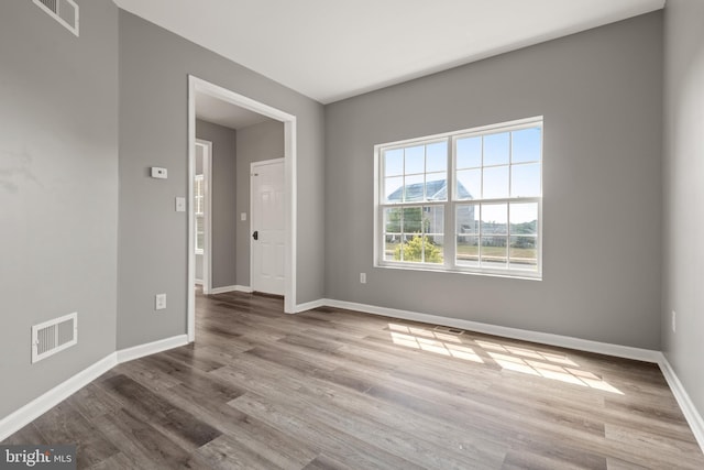 spare room featuring light hardwood / wood-style flooring