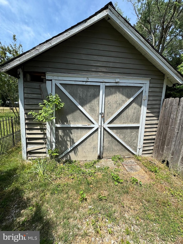 view of outdoor structure with a lawn