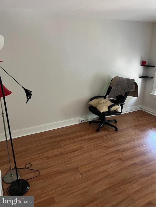 unfurnished room with hardwood / wood-style flooring