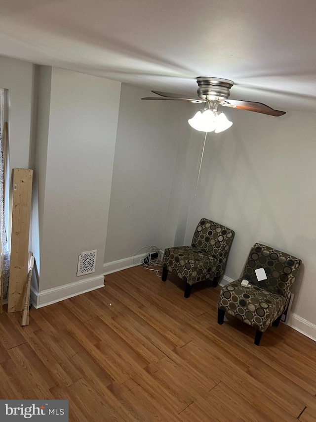 unfurnished room featuring hardwood / wood-style flooring and ceiling fan