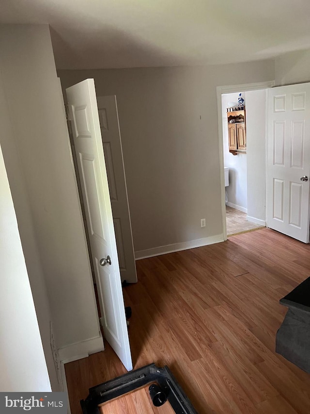 unfurnished bedroom with wood-type flooring