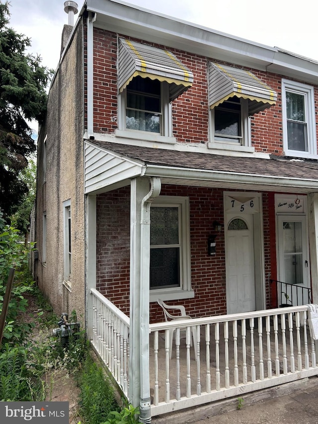 view of property with covered porch