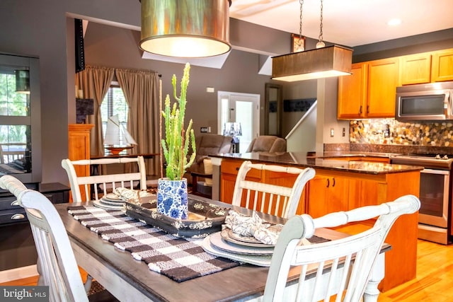 dining area with light hardwood / wood-style floors