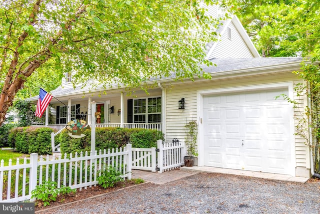 view of front facade with a garage and covered porch