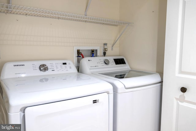 laundry area with separate washer and dryer